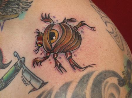 Robert Hendrickson - Eye beetle tattoo collar bone 